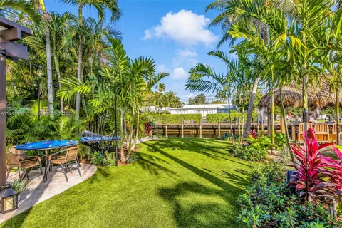 a view of a park with large trees