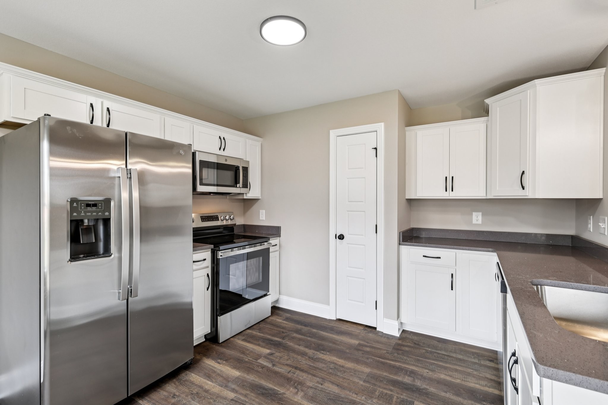 3 Echo Ridge Oak Grove, KY 42262 - Photo 11 of 46 a modern kitchen with stainless steel appliances granite countertop a refrigerator and a stove top oven