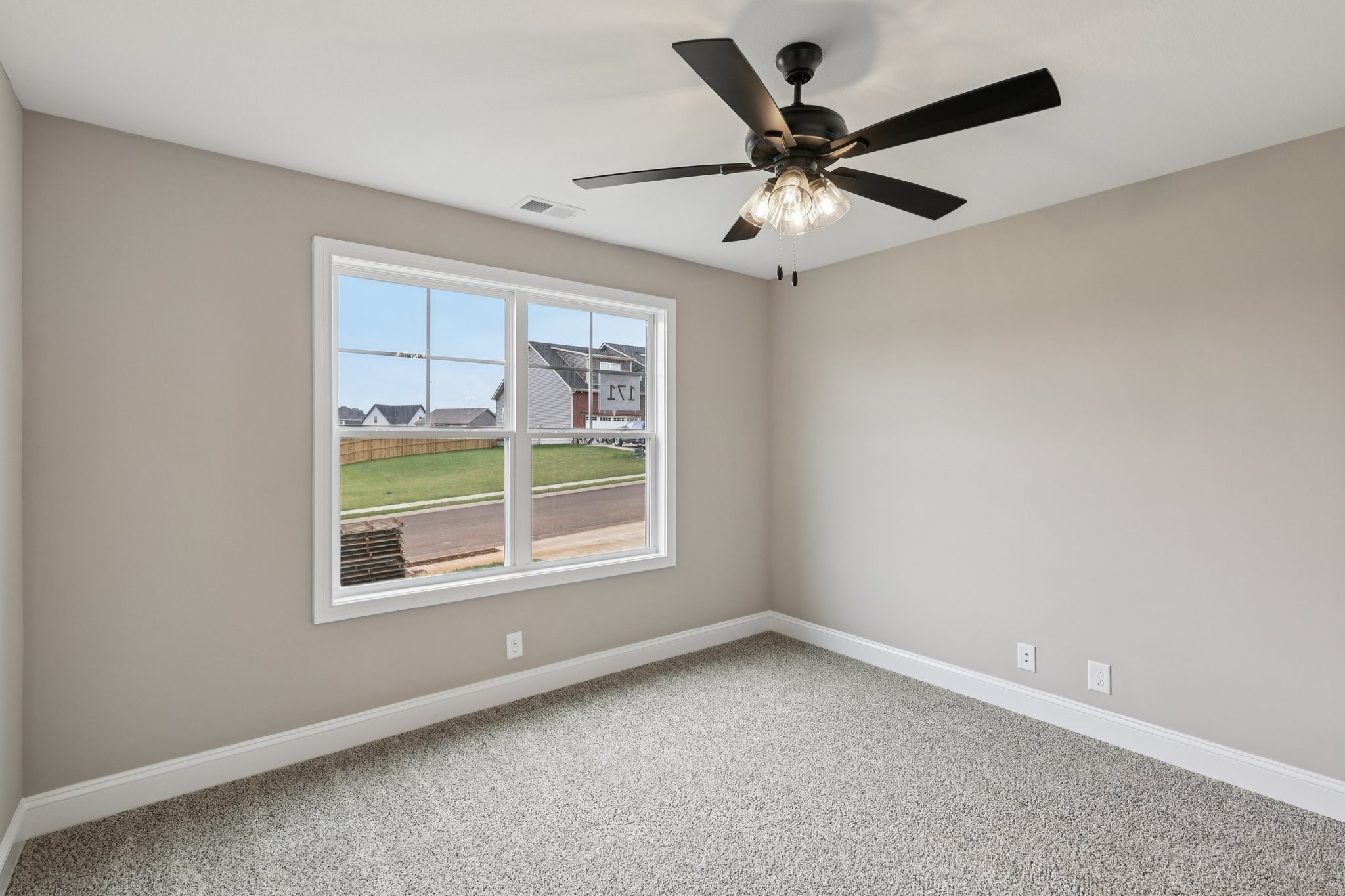 3 Echo Ridge Oak Grove, KY 42262 - Photo 30 of 46 an empty room with a window and a ceiling fan