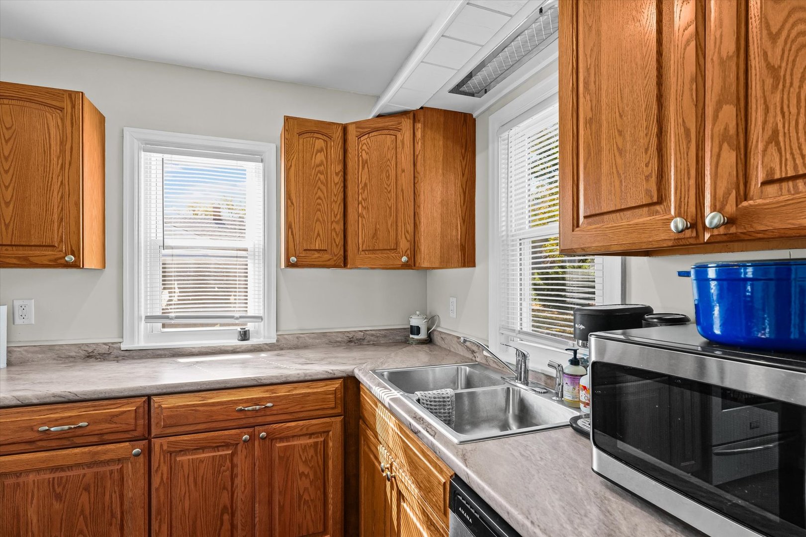 209 South Walnut Street Buckley, IL 60918 - Photo 14 of 30 a kitchen with granite countertop a sink a stove and cabinets