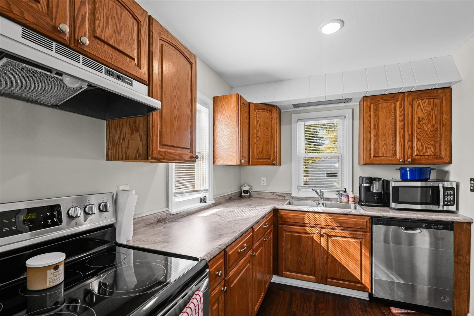 209 South Walnut Street Buckley, IL 60918 - Photo 16 of 30 a kitchen with stainless steel appliances granite countertop a sink stove and cabinets
