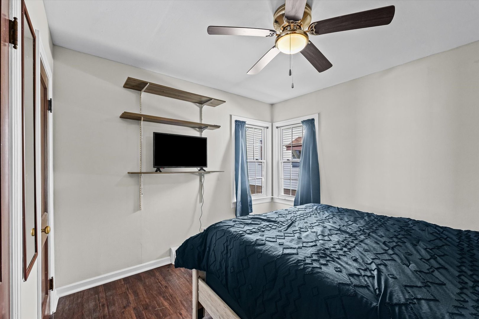 209 South Walnut Street Buckley, IL 60918 - Photo 20 of 30 a bedroom with a bed and a flat screen tv
