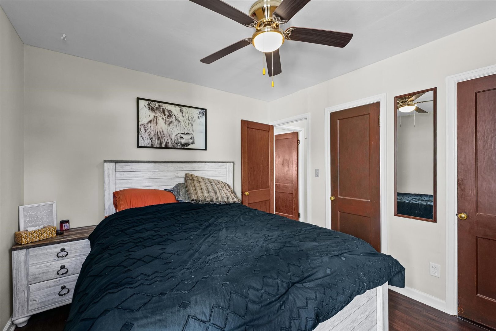 209 South Walnut Street Buckley, IL 60918 - Photo 21 of 30 a bedroom with a bed and a chandelier