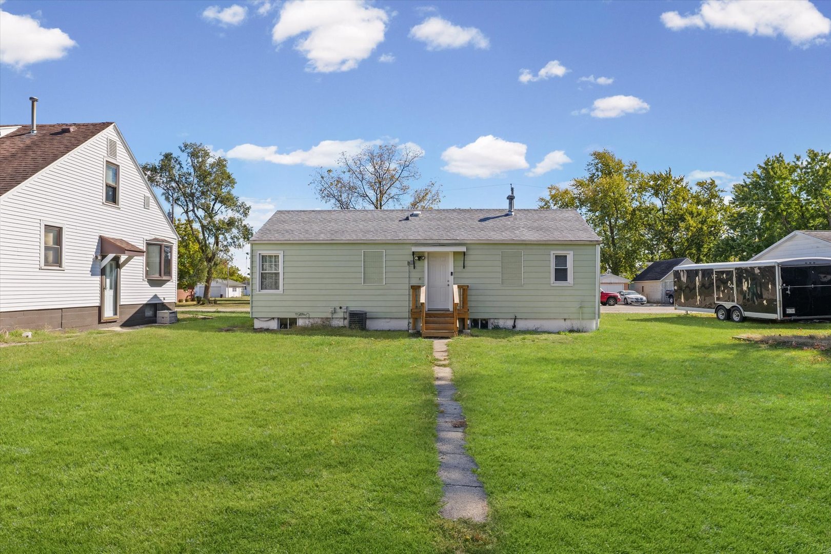 209 South Walnut Street Buckley, IL 60918 - Photo 26 of 30 a front view of a house with a garden