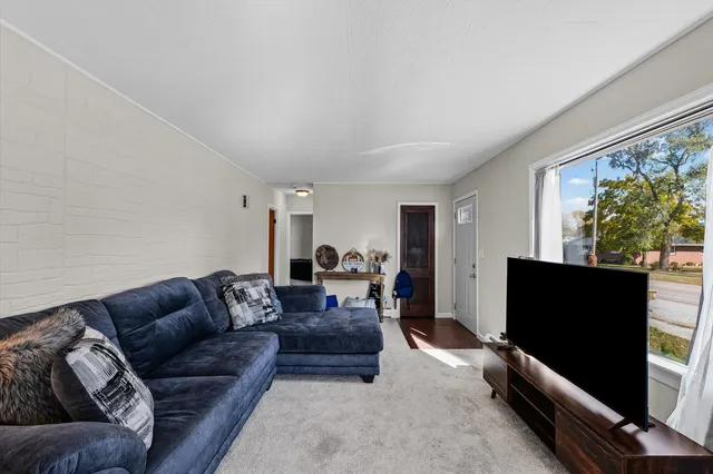 a living room with a couch and a window