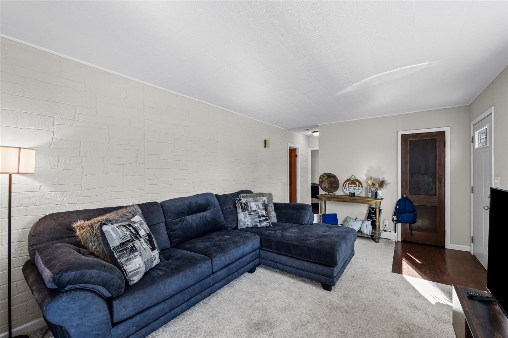 209 South Walnut Street Buckley, IL 60918 - Photo 9 of 30 a living room with a couch and a window