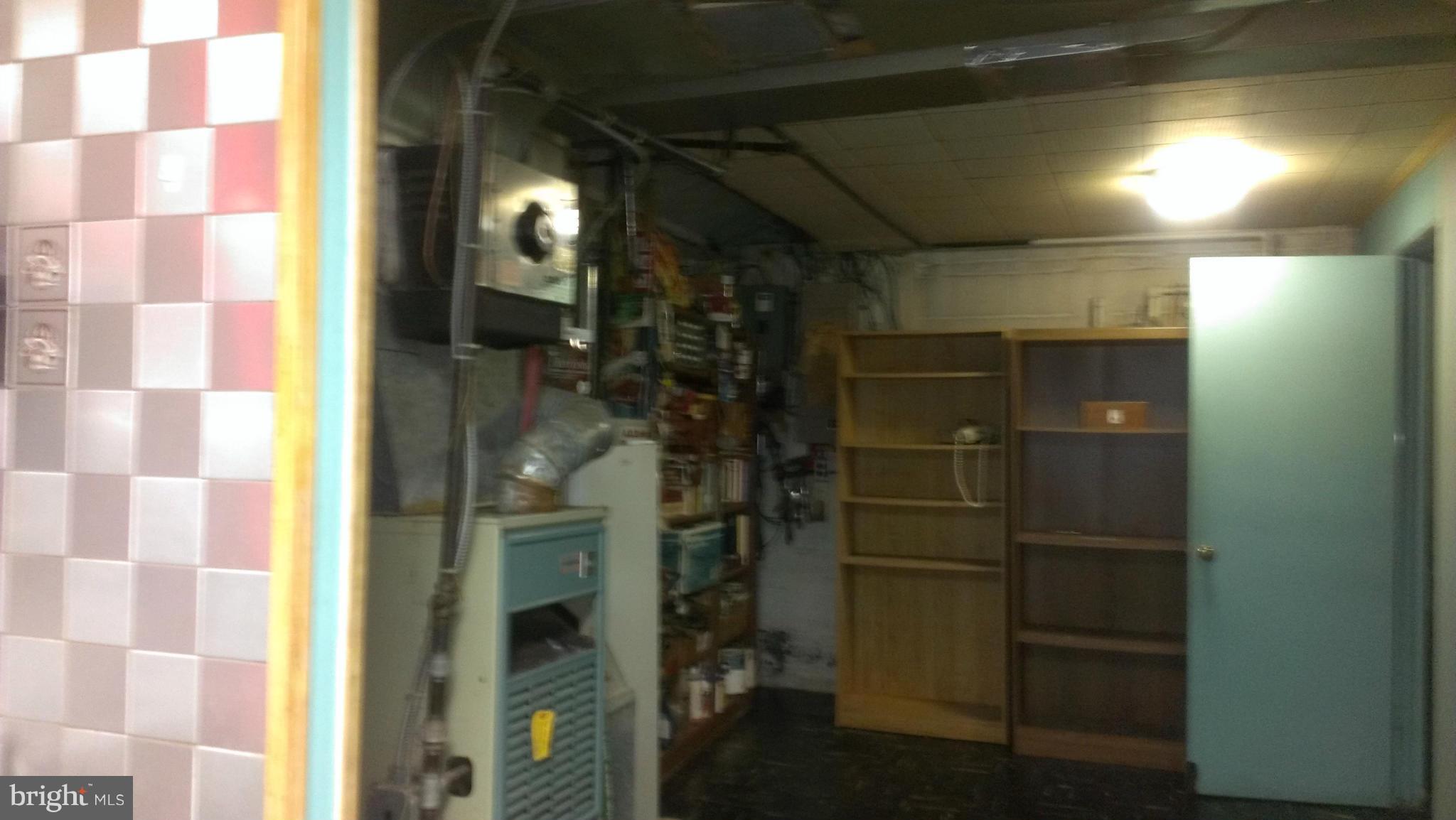 8601 11th Avenue Silver Spring, MD 20903 - Photo 10 of 16 utility room with shelf space