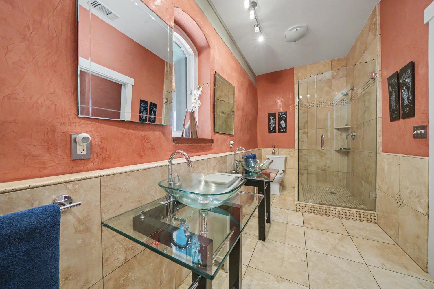 15070 Willow Creek Road Ione, CA 95640 - Photo 52 of 66 a bathroom with a mirror and a shower