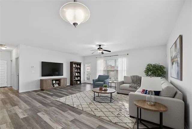 a living room with furniture and a flat screen tv