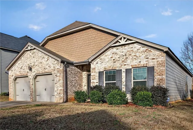 a view of a grey door of the house