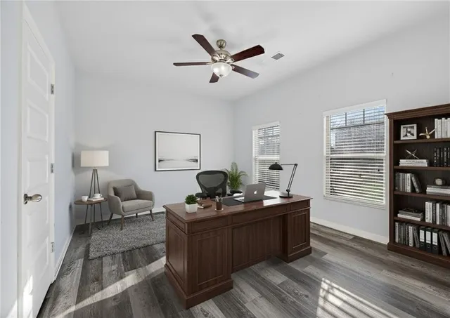 a work room with furniture and window