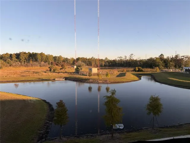 a view of a road with a building in the background
