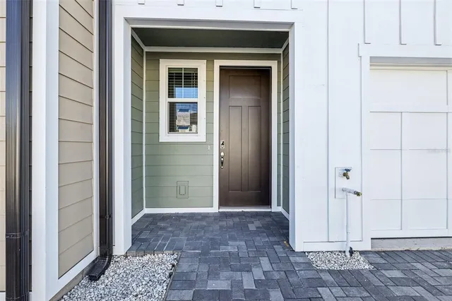 a view of a livingroom with wooden floor and a cabinet
