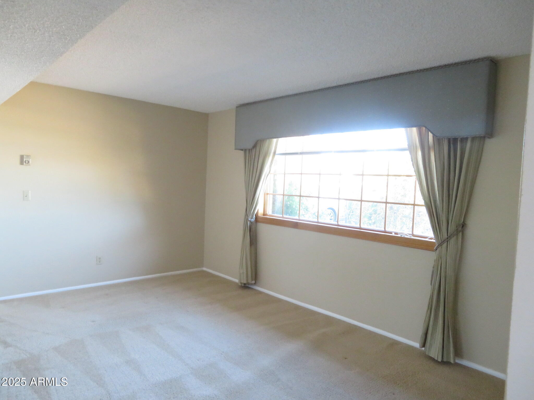 3720 Greenbrier Road Sierra Vista, AZ 85650 - Photo 13 of 30 an empty room with a window
