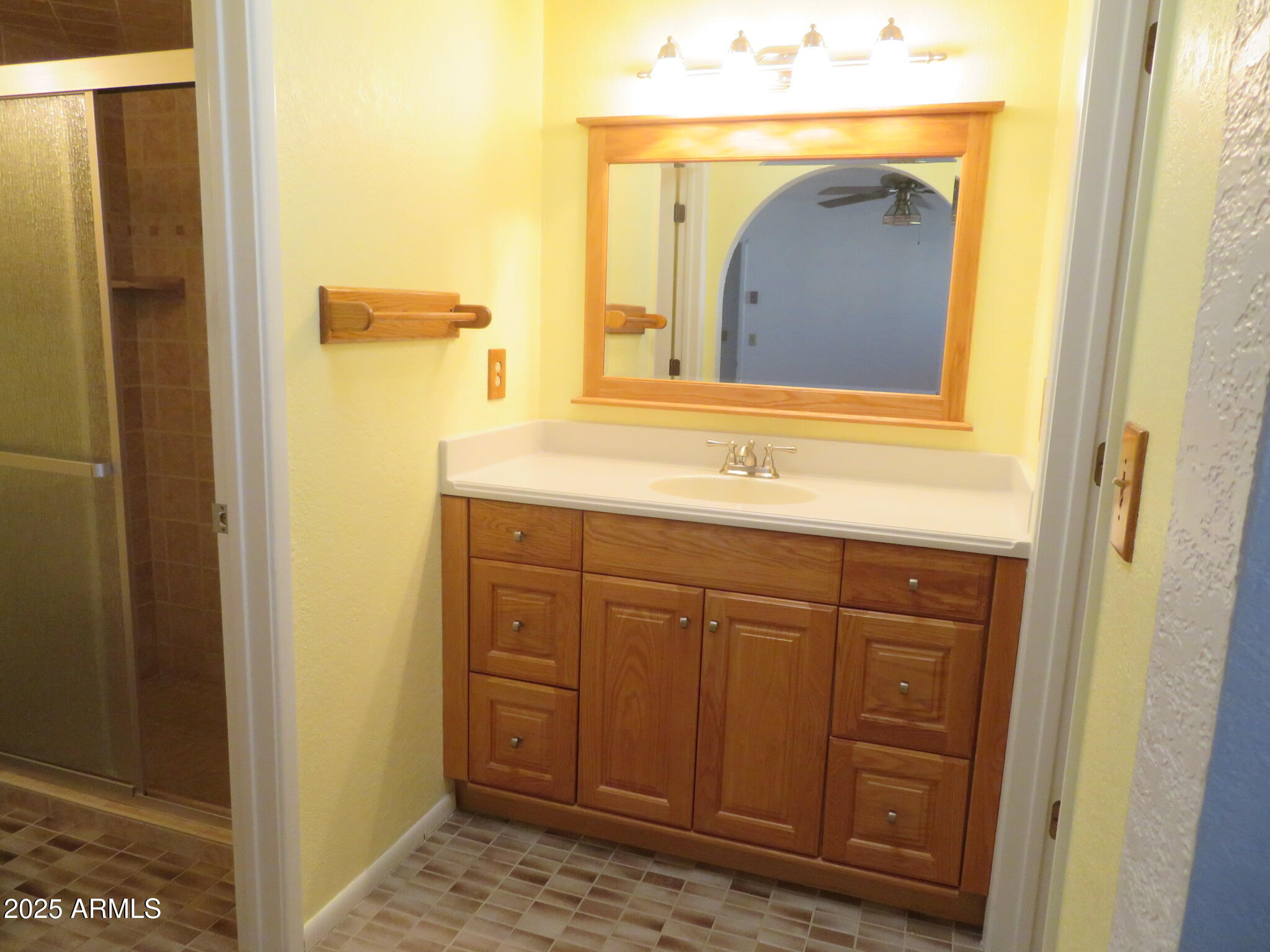 3720 Greenbrier Road Sierra Vista, AZ 85650 - Photo 15 of 30 a bathroom with a sink and a mirror