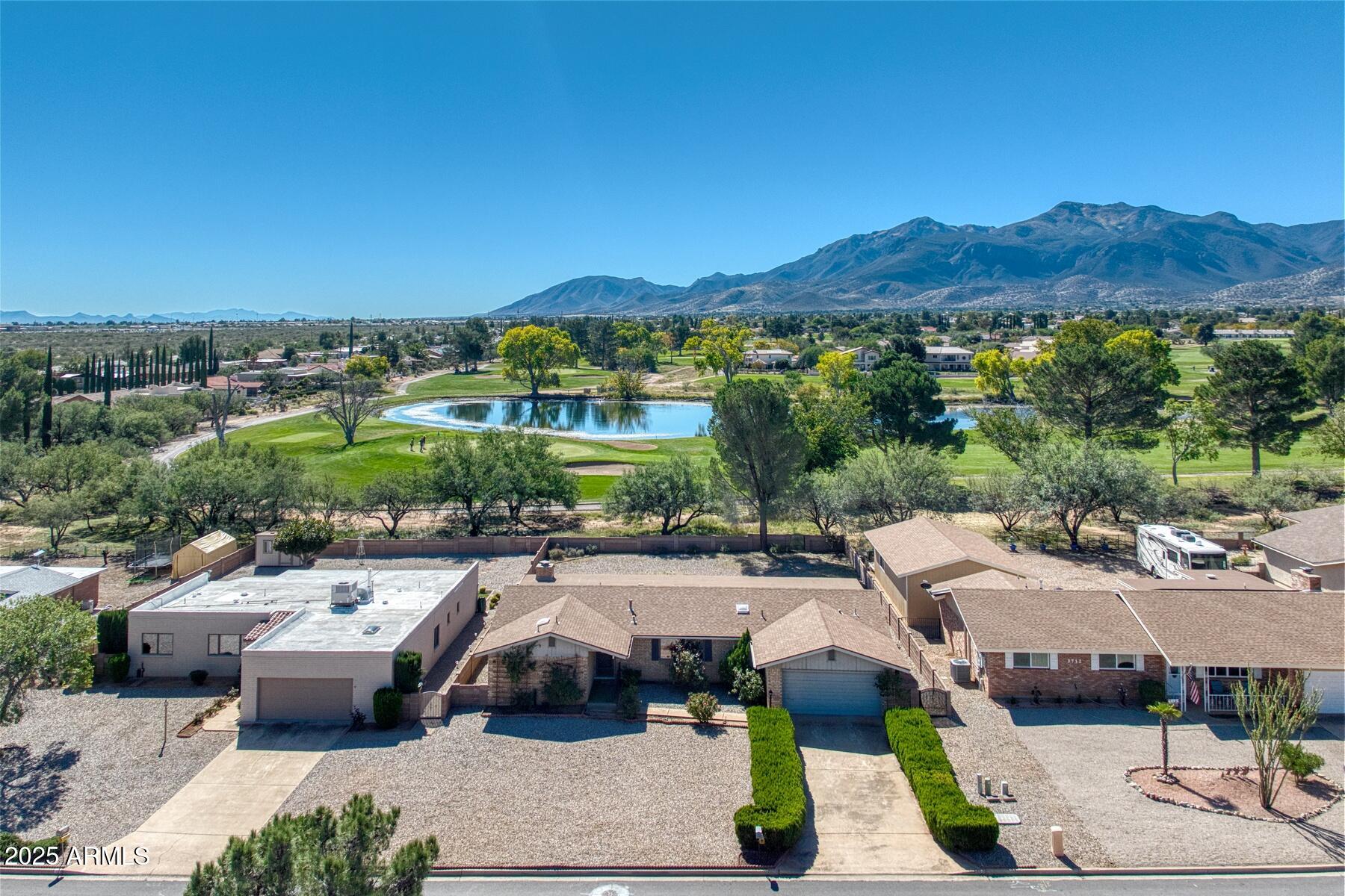 3720 Greenbrier Road Sierra Vista, AZ 85650 - Photo 2 of 30 a front view of a house with a garden and mountain view