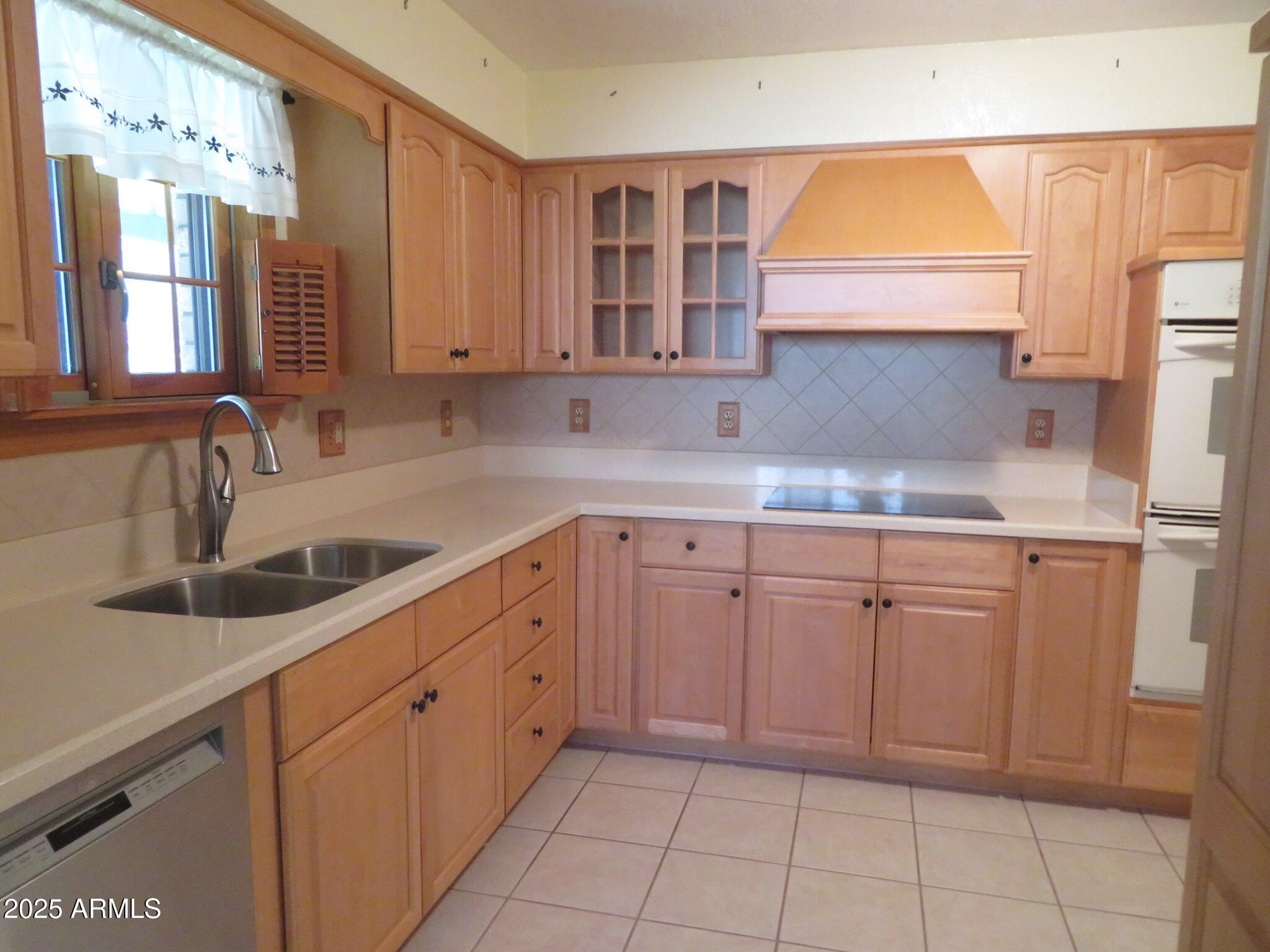 3720 Greenbrier Road Sierra Vista, AZ 85650 - Photo 8 of 30 a kitchen with a sink cabinets and window