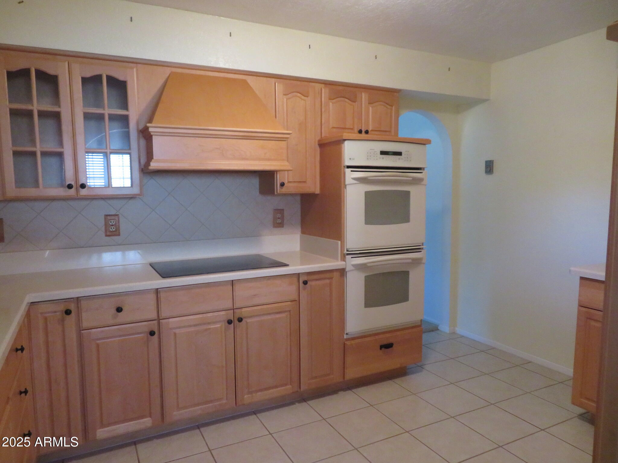 3720 Greenbrier Road Sierra Vista, AZ 85650 - Photo 9 of 30 a kitchen with cabinets and white appliances