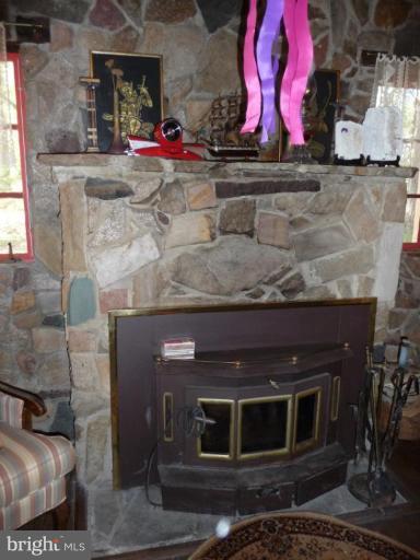 STONE FIREPLACE WITH INSERT