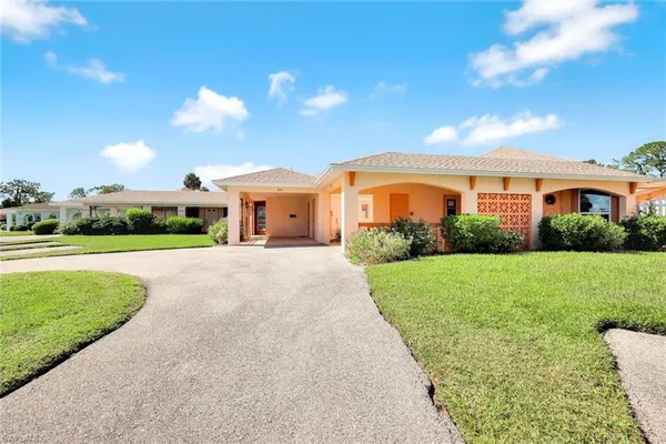 a view of a house with a yard