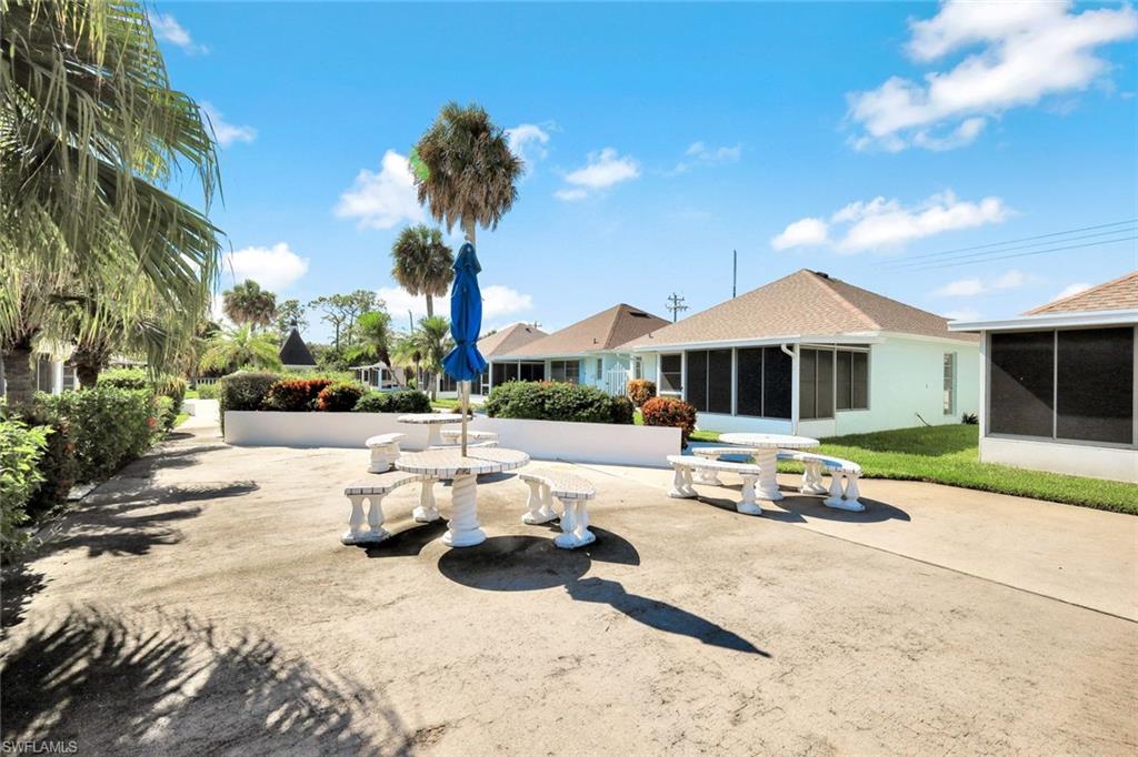 321 Dania Street Lehigh Acres, FL 33936 - Photo 21 of 22 a front view of a house with entertaining space