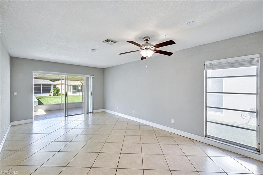 321 Dania Street Lehigh Acres, FL 33936 - Photo 4 of 22 a view of an empty room with a window