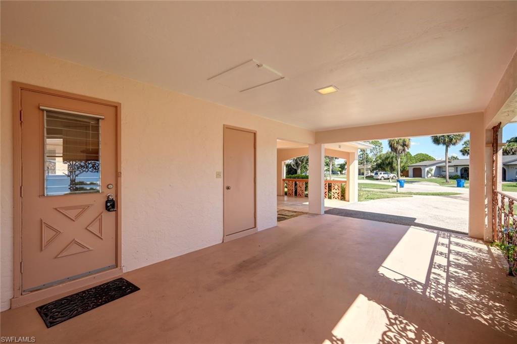 321 Dania Street Lehigh Acres, FL 33936 - Photo 6 of 22 a view of an empty room and glass door