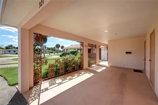 a view of a big room with windows and yard