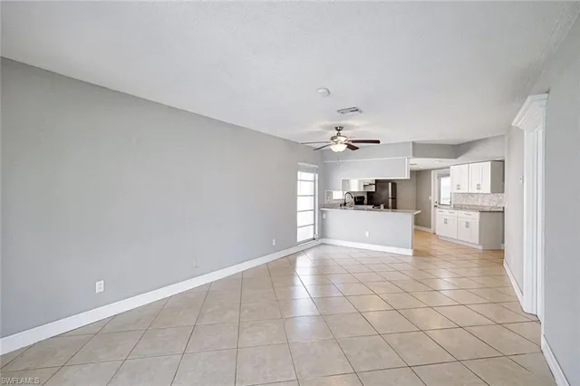 a view of a kitchen with a sink and a cabinets