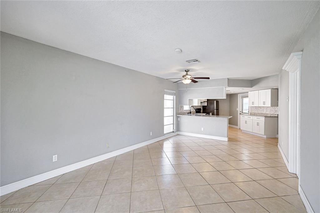 321 Dania Street Lehigh Acres, FL 33936 - Photo 10 of 22 a view of a kitchen with a sink and a cabinets