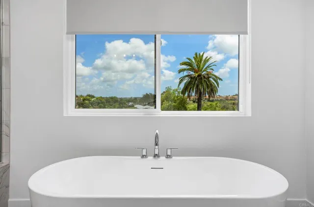 a white bath tub sitting next to a white sink