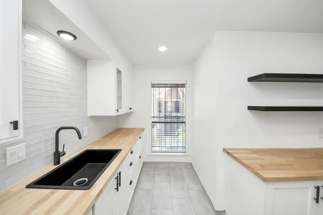 a kitchen with a sink and a stove