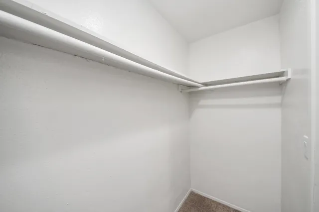 a view of an empty walk in closet