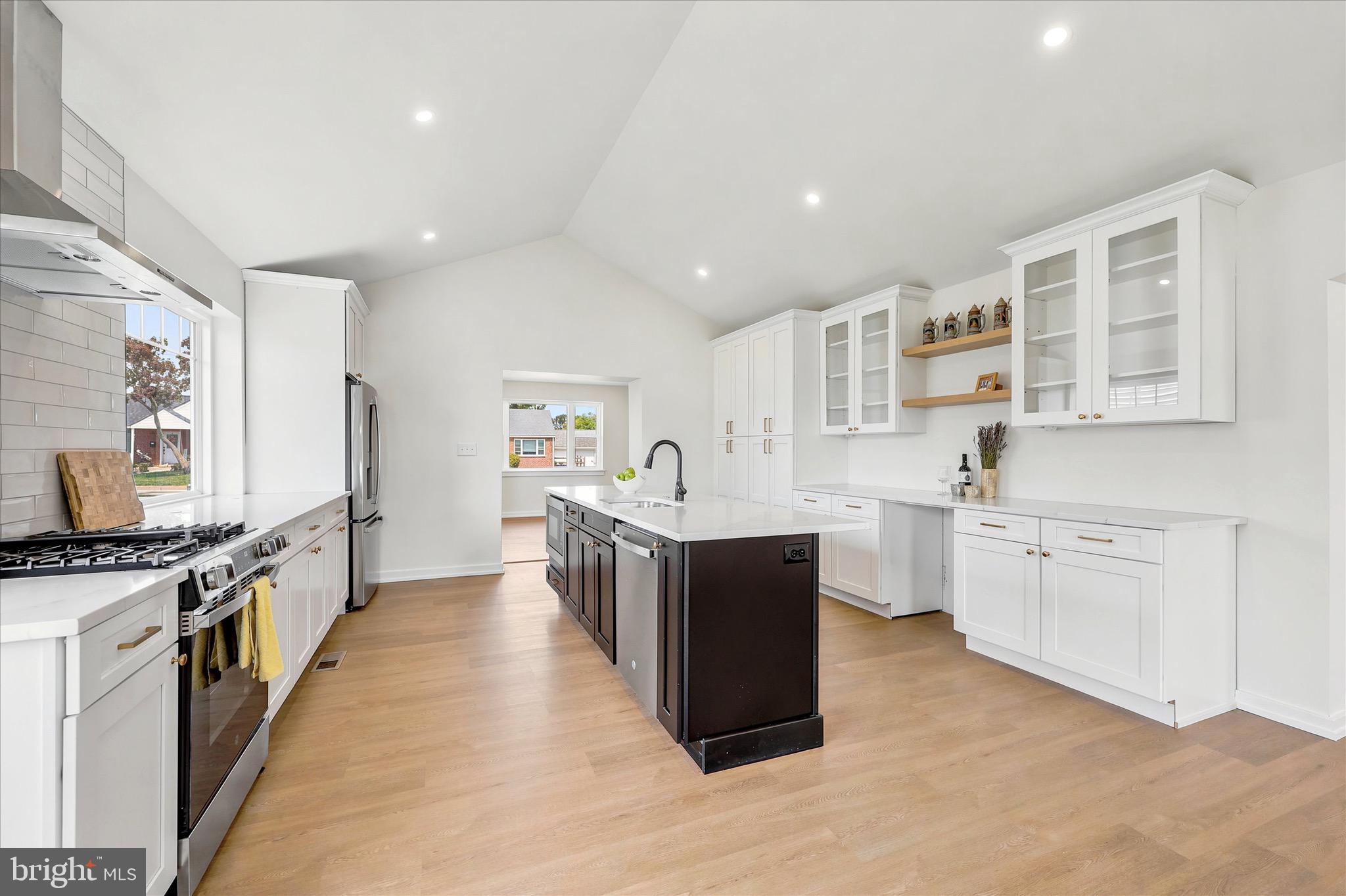 8 James Road Broomall, PA 19008 - Photo 11 of 35 a large kitchen with stainless steel appliances sink a stove and cabinets