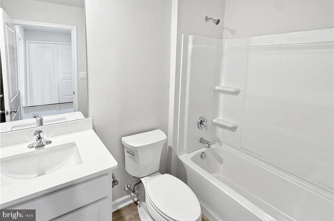 1184 Martin Road Breinigsville, PA 18031 - Photo 11 of 12 a white toilet sitting next to a bathroom sink