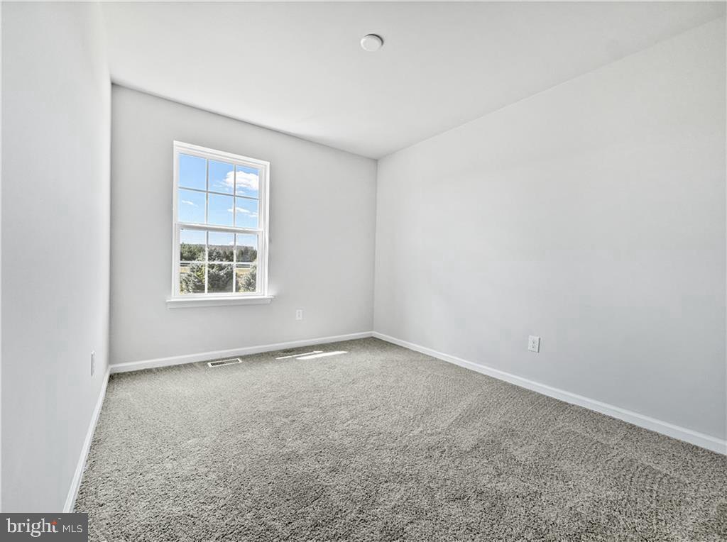 1184 Martin Road Breinigsville, PA 18031 - Photo 5 of 12 an empty room with windows
