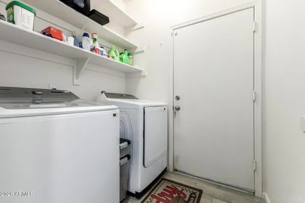 a utility room with dryer and washer