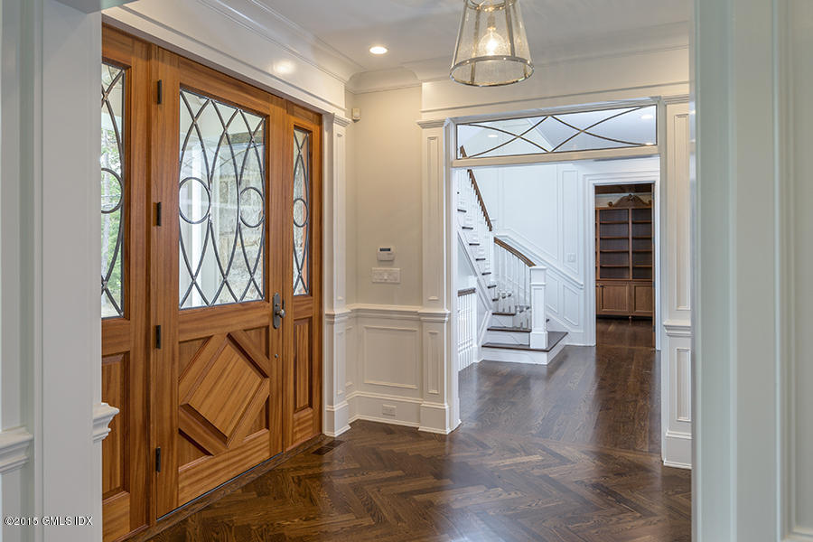 146 Hendrie Avenue Riverside, CT 06878 - Photo 12 of 32 a view of an entryway with wooden floor and stairs