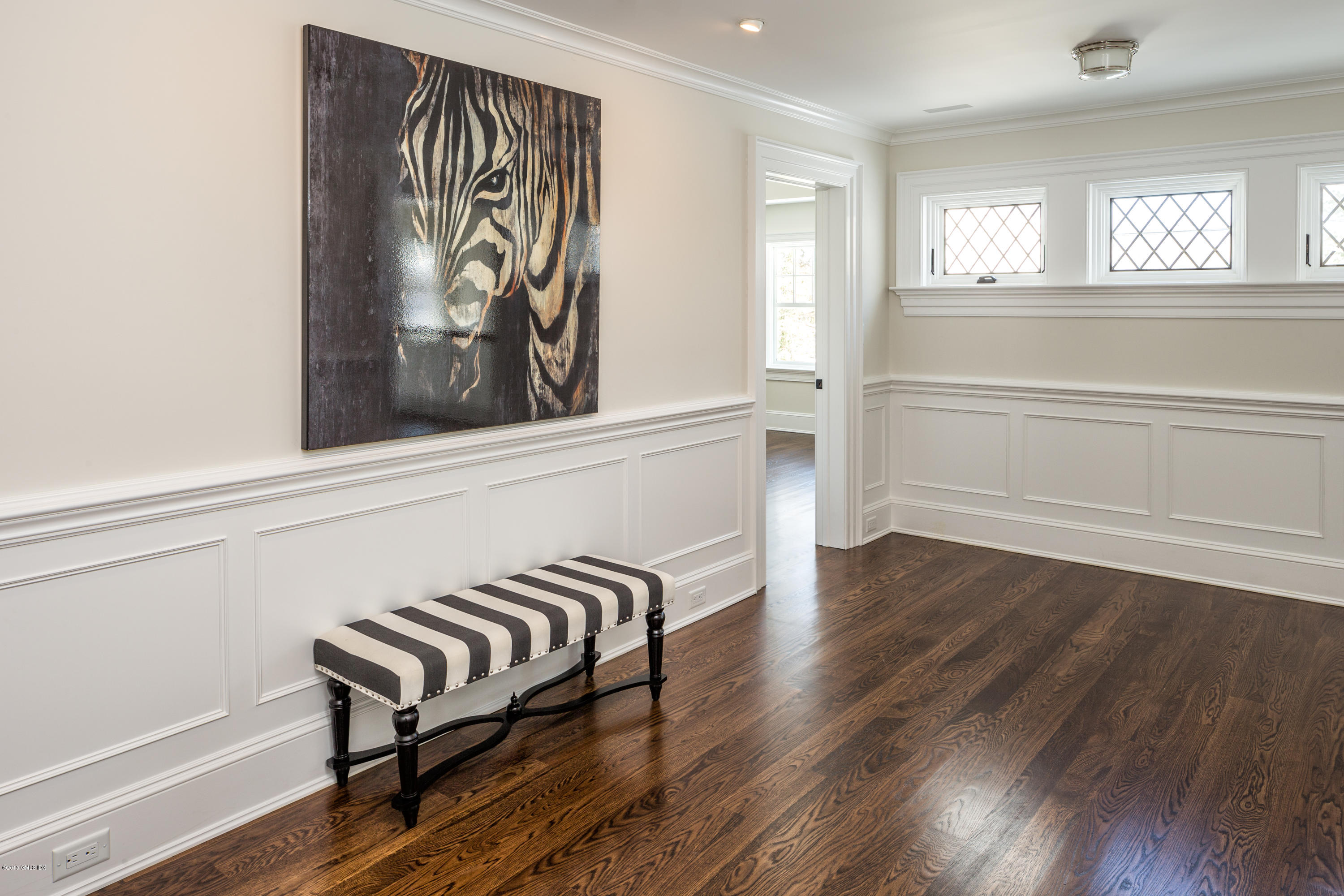 146 Hendrie Avenue Riverside, CT 06878 - Photo 18 of 32 a view of a room with wooden floor and a window