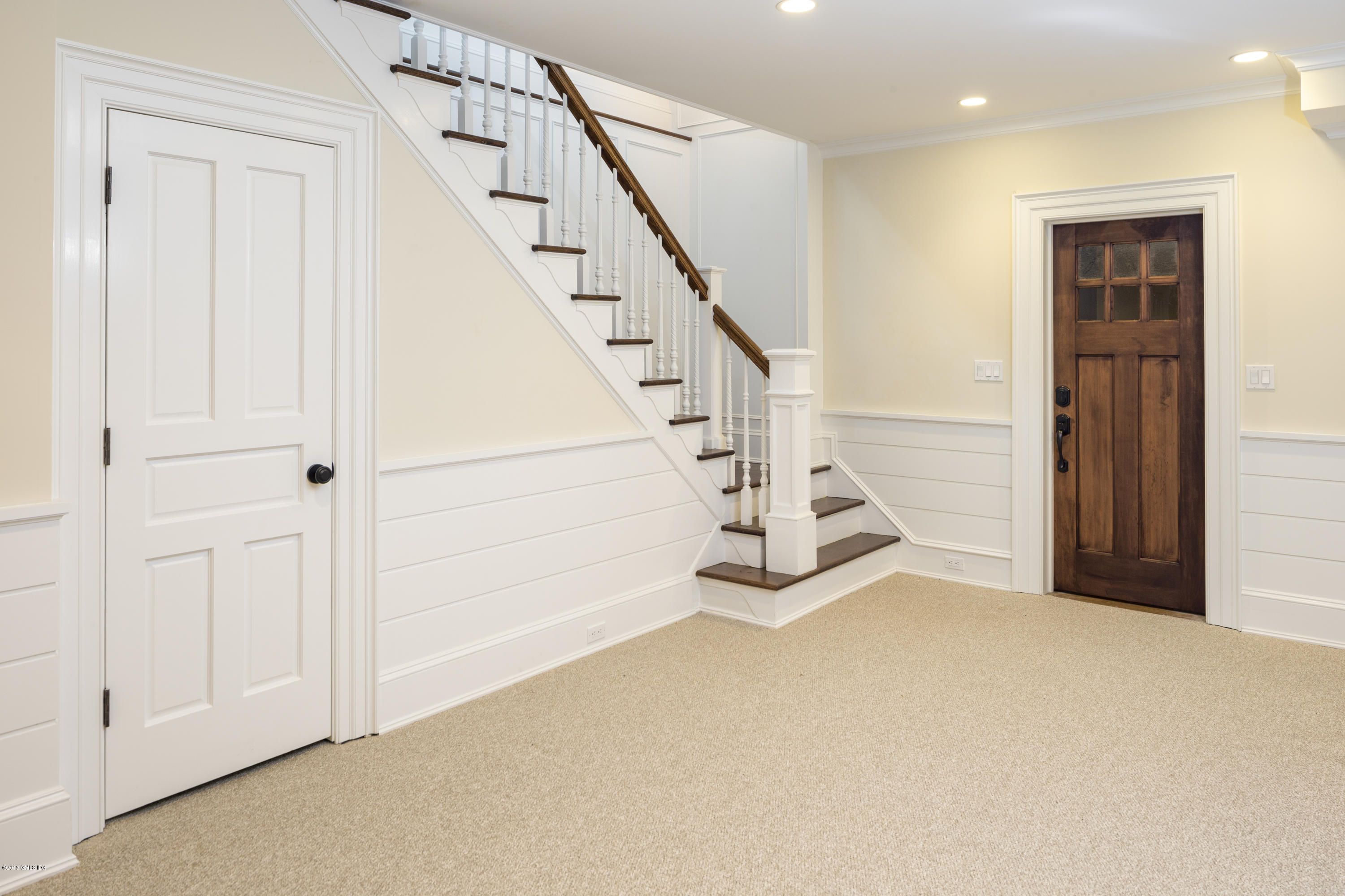 146 Hendrie Avenue Riverside, CT 06878 - Photo 25 of 32 a view of a livingroom with white walls stairs