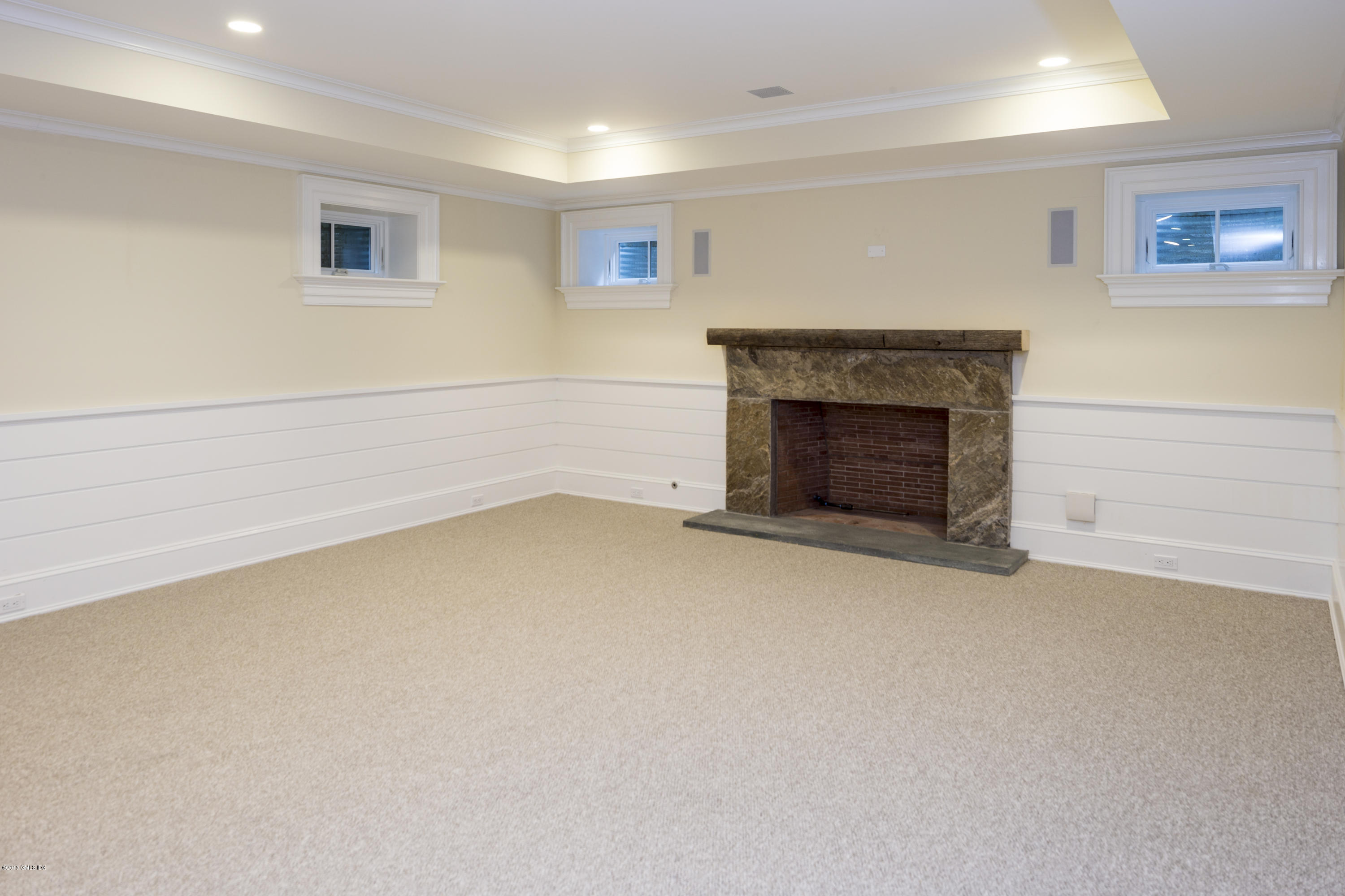 146 Hendrie Avenue Riverside, CT 06878 - Photo 27 of 32 an empty room with a fireplace