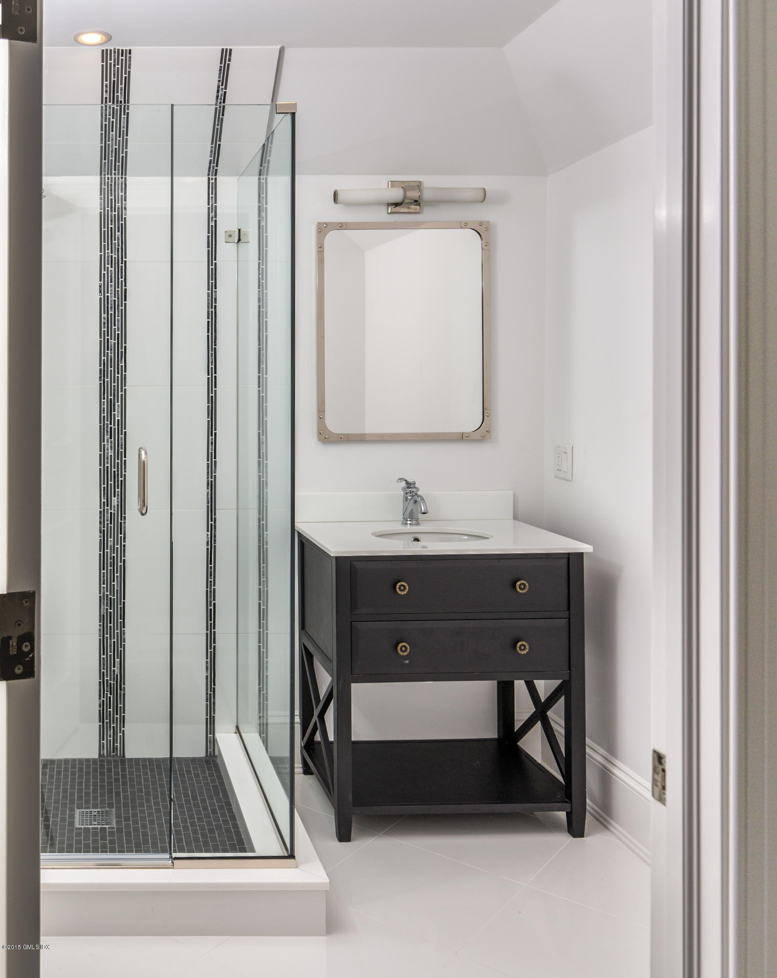 146 Hendrie Avenue Riverside, CT 06878 - Photo 28 of 32 a bathroom with a sink and a mirror