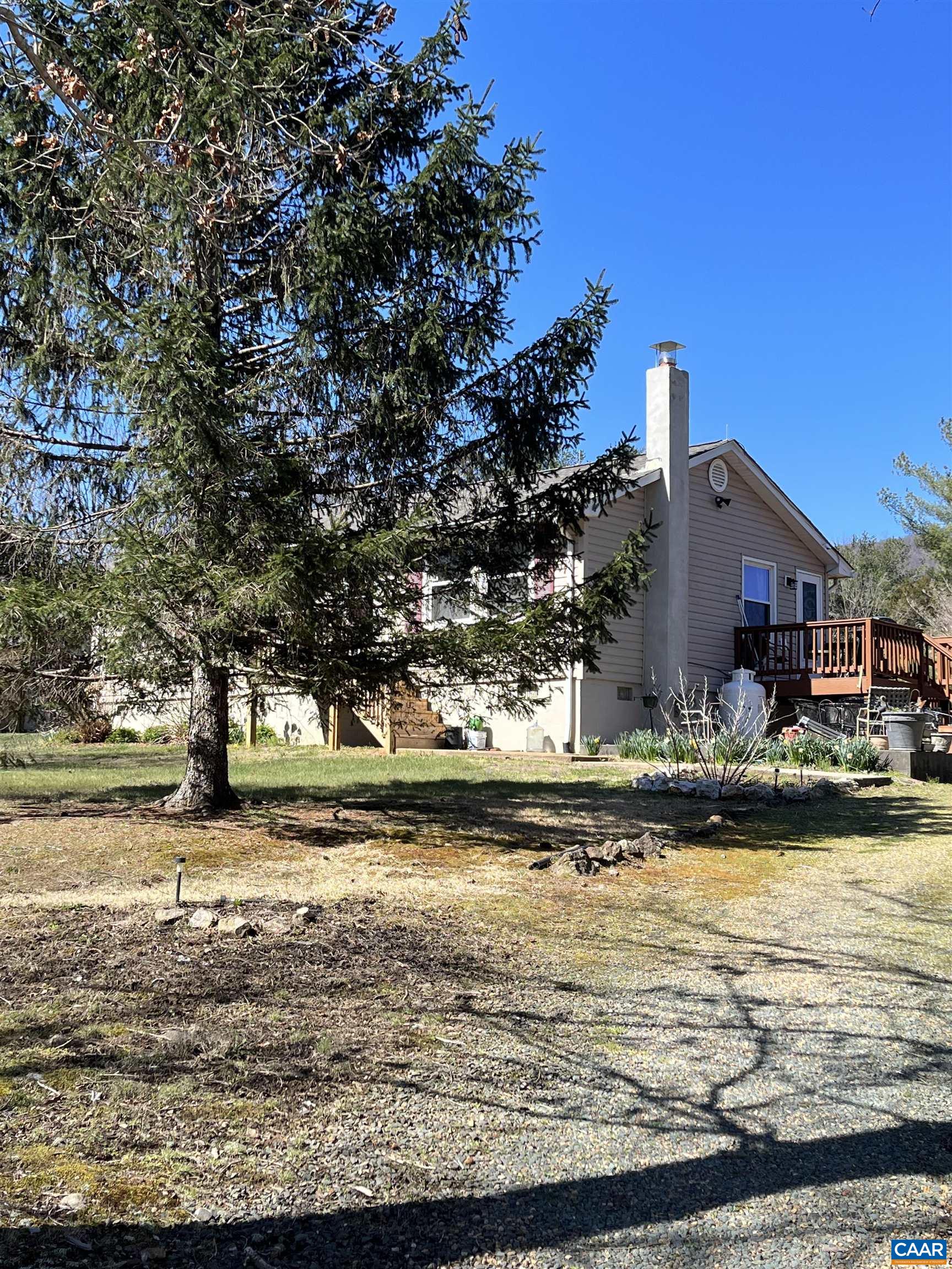 4244 Slam Gate Road Crozet, VA 22932 - Photo 2 of 3 a front view of a house with a yard