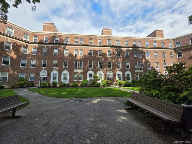 a view of a building with a yard