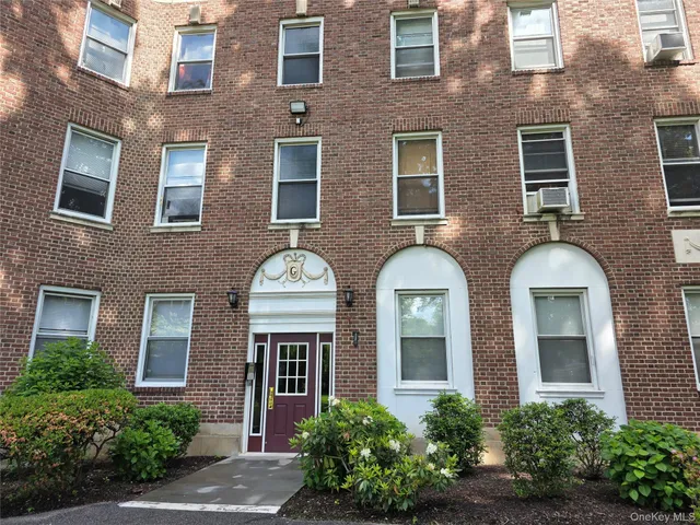 a front view of a multi story residential apartment building