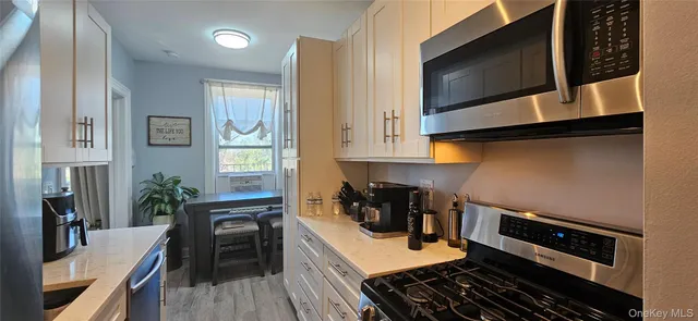 a kitchen with a stove and a microwave