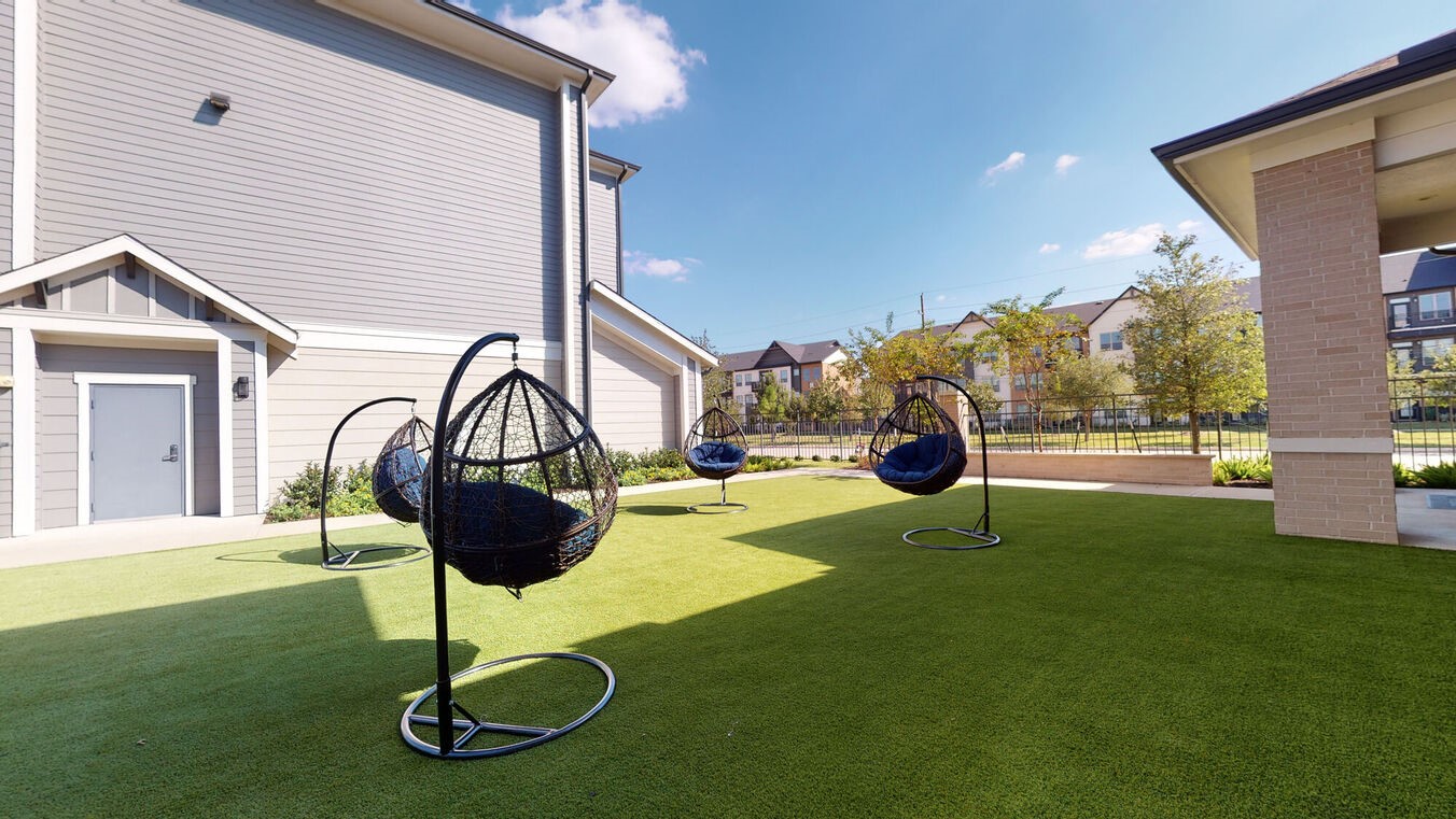 24002 Colonial Parkway, Unit 6130 Katy, TX 77493 - Photo 21 of 31 a swimming pool with a table and chairs