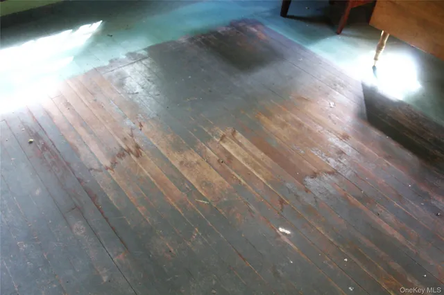 a view of staircase with railing and a window