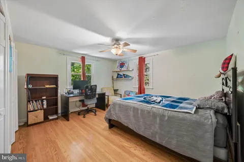 a bedroom with furniture and a chandelier
