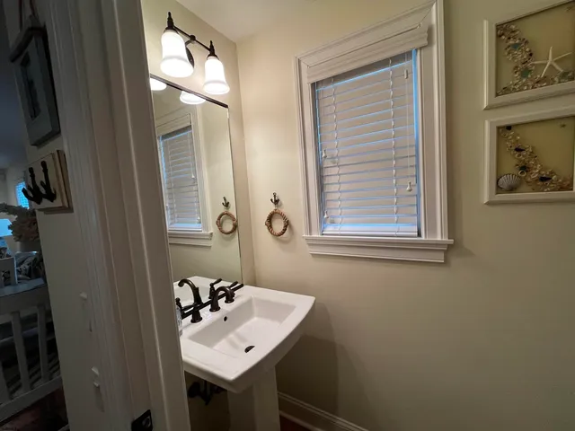 a white toilet sitting next to a window